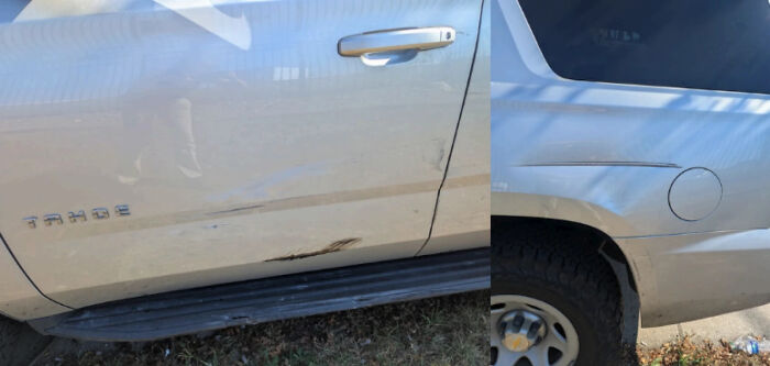 White Tahoe SUV with visible side scratches and dents, related to federal agent shooting incident in Chicago.