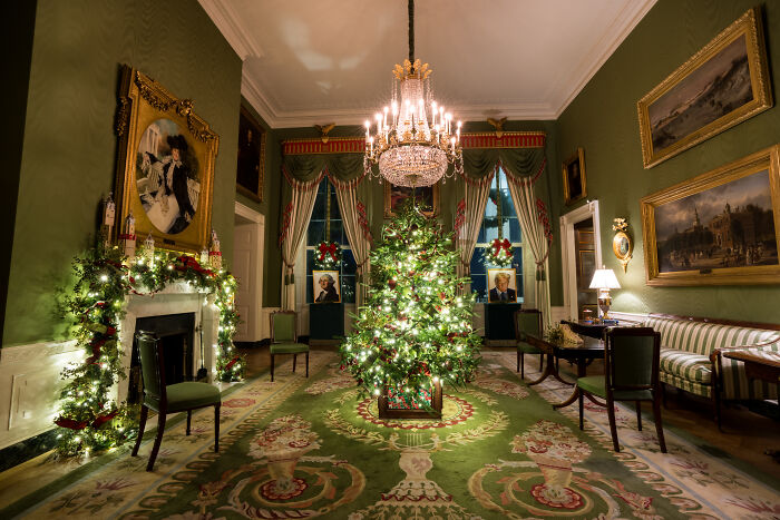 Christmas tree and garlands with lights in an elegant room, showcasing Melania Trump's 2025 holiday decorations style.