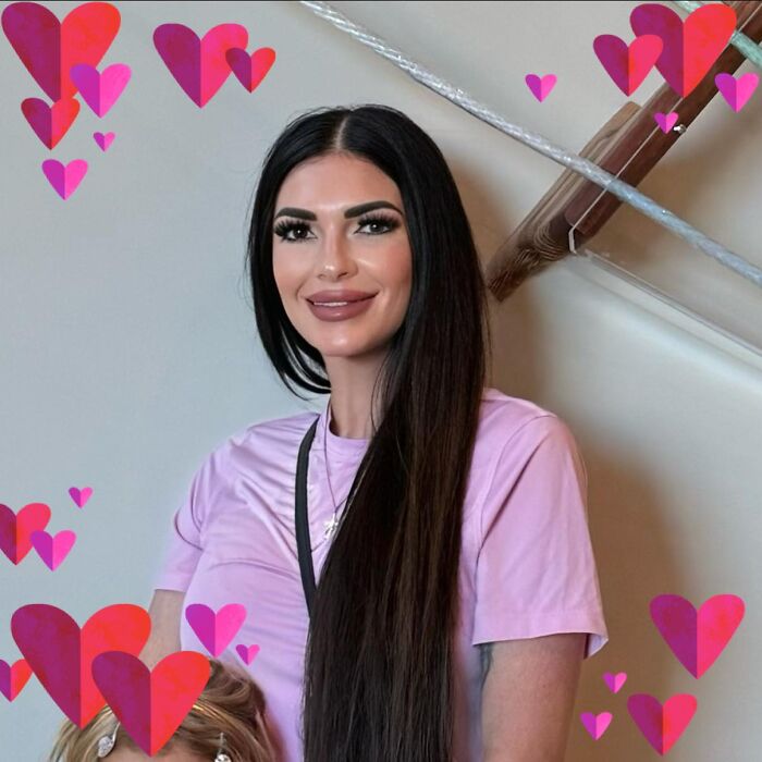 Mom with twin 6-year-olds posing indoors surrounded by pink and red heart graphics amid mansion tragedy and divorce.