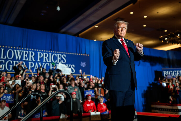 Donald Trump at a rally, sending unnerving signal about his plans for the future with supporters in the background.