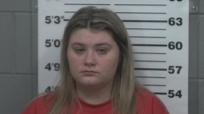 Mugshot of a tearful pageant queen involved in a high-profile college dorm case with partner&rsquo;s toddler.