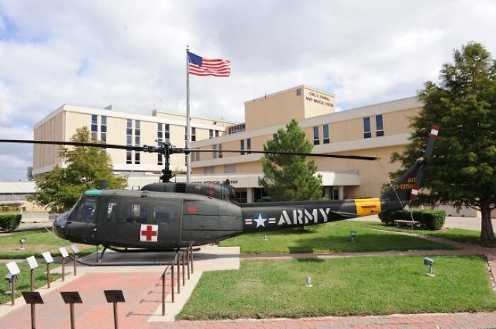 Army gynecologist accused of secretly recording patients during examinations at a military medical facility with helicopter on display.