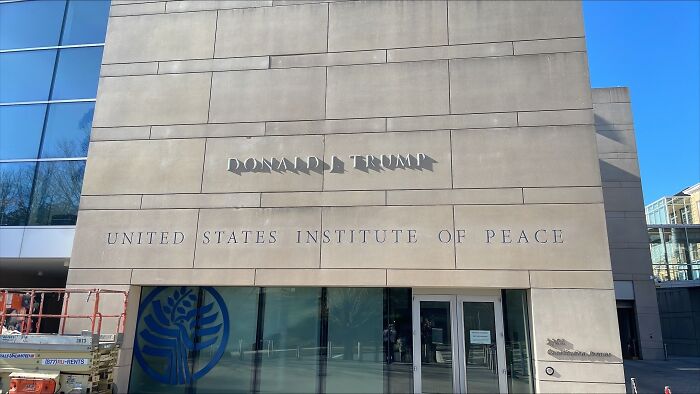 Exterior of the United States Institute of Peace building featuring Donald J Trump name, related to Trump battleships naming.