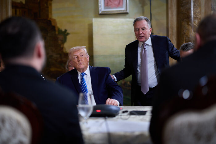 Zelenskyy showing a serious expression during a formal meeting following a controversial political claim.