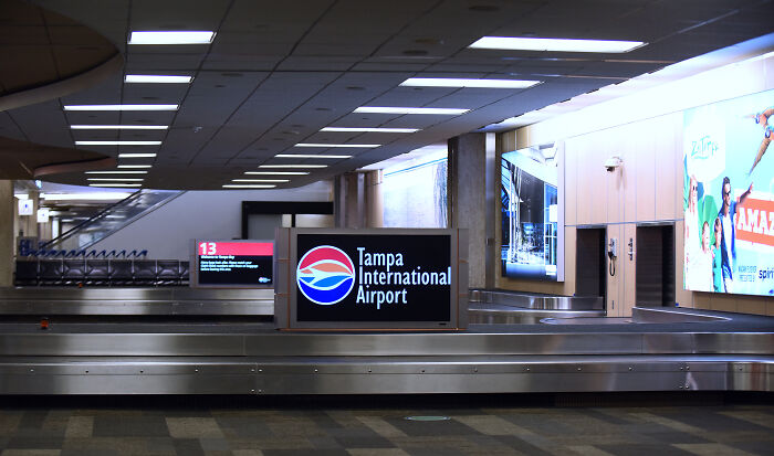 Empty baggage claim area at Tampa International Airport, related to hot mic moment capturing TSA staff expressing fear.