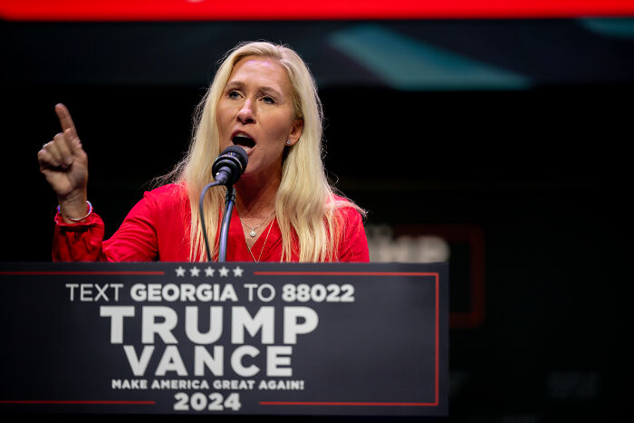 Marjorie Taylor Greene speaking at a Trump Vance 2024 rally, addressing threats involving Epstein predators.