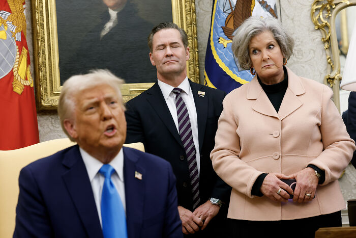 Trump&rsquo;s chief of staff backpedaling with concerned expression during a meeting in the Oval Office.