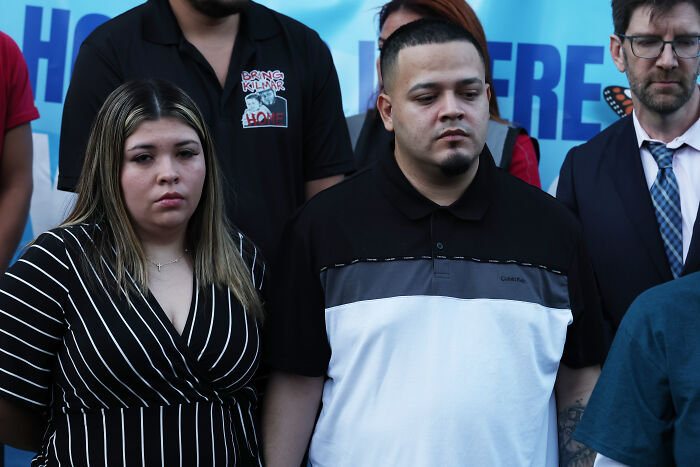 Kilmar Abrego Garcia at a public event, standing with supporters, vowing to fight Trump admin policies and actions.