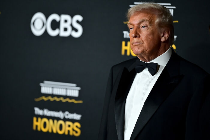 Donald Trump in a black tuxedo at the Kennedy Center Honors amid backlash over proposed Trump rename cancellations.