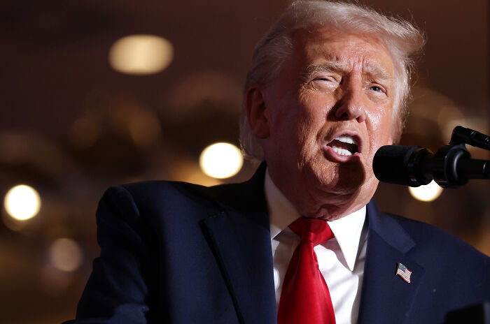 Former president speaking at a podium with intense expression, related to terrifying events closer to WW3 in 2025.