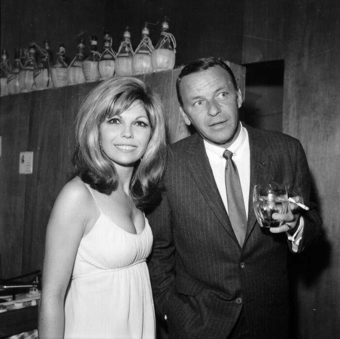 Nancy Sinatra with father Frank Sinatra in a vintage black and white photo, highlighting Nancy Sinatra Trump supporter remarks.