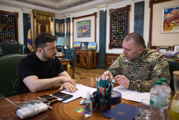 Ukrainian officials in discussion, planning a secret deep strike strategy amid reports involving hungover Russians.