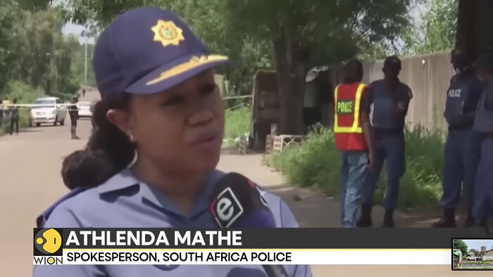 South Africa police spokesperson speaking on fatal mass shooting with child and teens among victims at illegal bar.