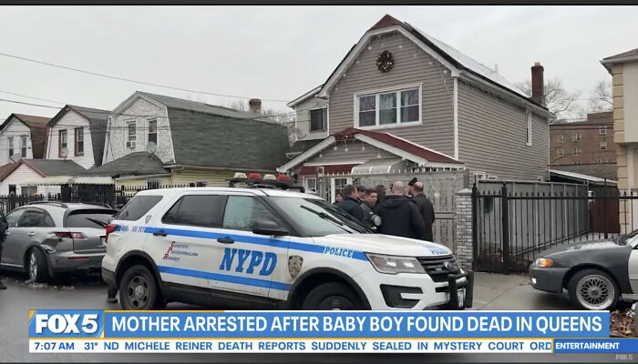 NYPD police vehicle outside residential home in Queens during NYC mom accused of taking infant son&rsquo;s life investigation.