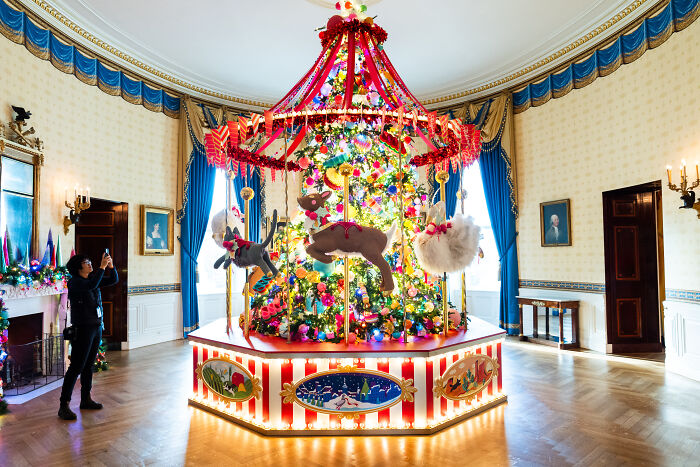 Festive carousel-style Christmas decorations with colorful ornaments and lights featured in Melania Trump&rsquo;s 2025 holiday display.