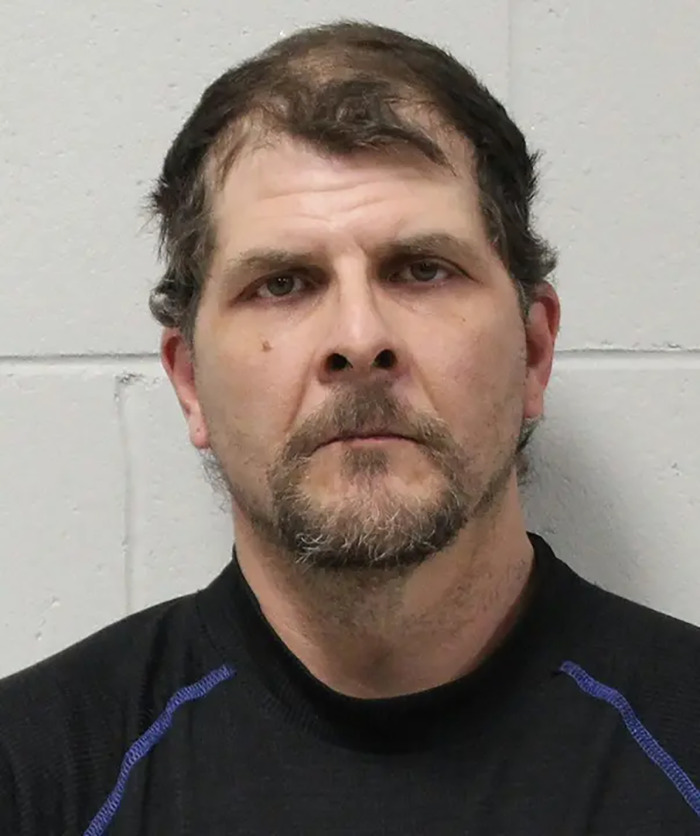 Mugshot of a man accused in case involving parents and the forcible separation of their slain daughter and unborn child.