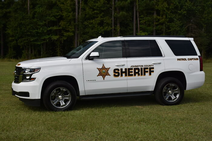 Johnston County sheriff patrol vehicle parked on grass, related to father allegedly hiding children&rsquo;s bodies case.