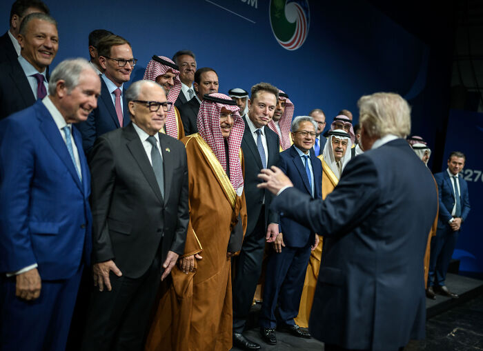 Group photo with Elon Musk and Middle Eastern leaders, highlighting Trump&rsquo;s anti-democracy agenda and historical radical plans.