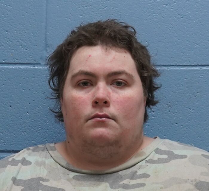 Mugshot of a man arrested related to case involving 29 deceased dogs found by distressed tradesman during call-out.