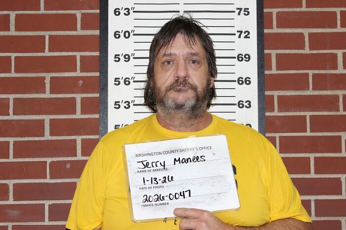 Mugshot of a man in a yellow shirt against height chart, related to Missouri couple charged after teens locked in chicken pen.