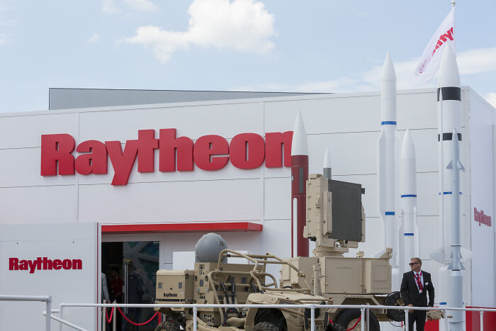 Raytheon military defense system display outside with missiles and equipment, linked to the Dream Military price tag discussion.