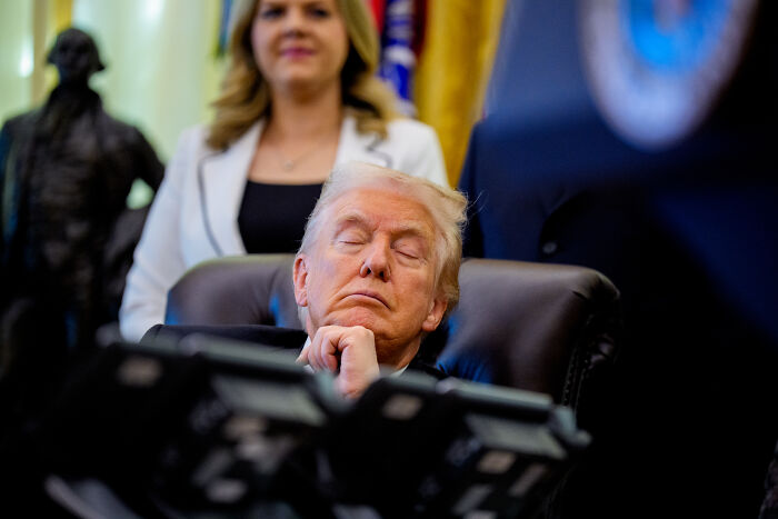 Former President Trump seated with eyes closed, highlighting health issues, compression socks, and makeup use.