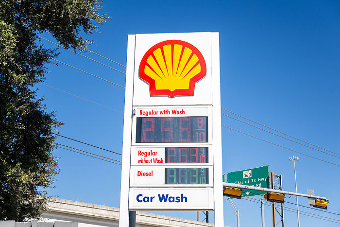 Shell gas station price sign showing gas prices with blue sky, related to Trump fact-checked on gas prices topic.