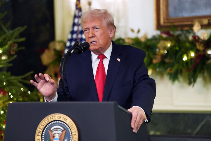 Portrait of a man in a suit speaking at a podium with presidential seal, related to Volodymyr Zelenskyy&rsquo;s blunt take on U.S. capturing Maduro.