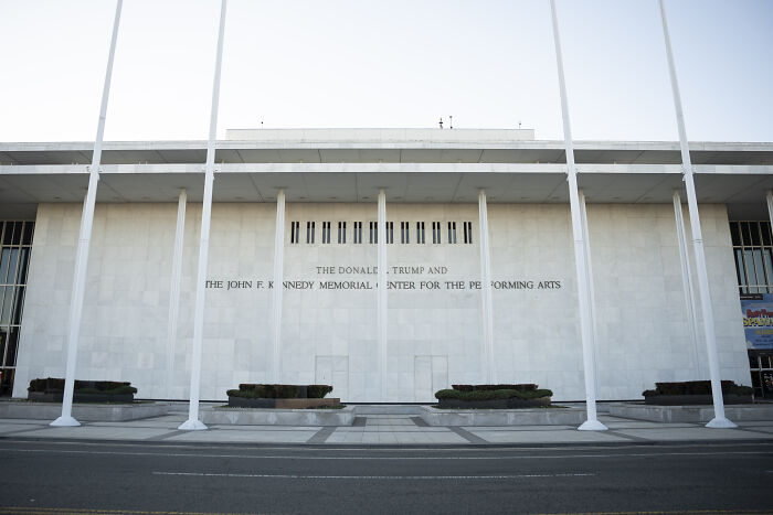 The Kennedy Center building exterior with visible signage referencing Trump and Kennedy Memorial Center.