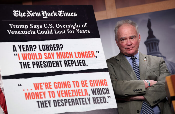 Senate lawmaker standing beside a board discussing U.S. oversight and war powers related to Venezuela and Trump&rsquo;s use of force.