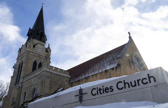 Minnesota church exterior with steeple and sign, related to White House acknowledging sharing modified protester image.
