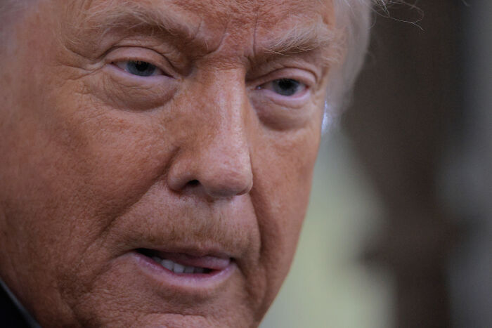 Close-up of orange face showing an embarrassed expression during a greeting snub with a woman's perfect reaction.