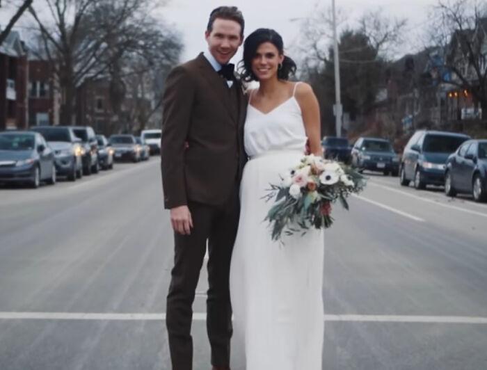 Slain Ohio couple in wedding attire standing on a street, bride holding bouquet, groom in brown suit