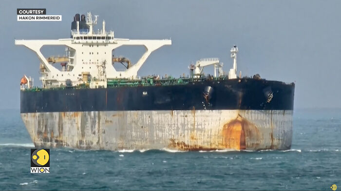 Russian-flagged oil tanker with rusted bow at sea after U.S. seizure, bow view
