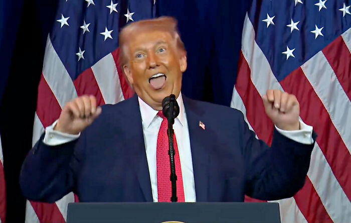 Former President Trump making animated gestures during a speech with American flags behind, viewed as AI by Chinese social media user.