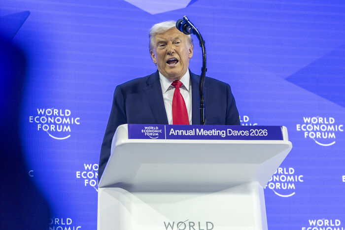 Former President Trump speaking at the World Economic Forum podium during the Annual Meeting Davos 2026.