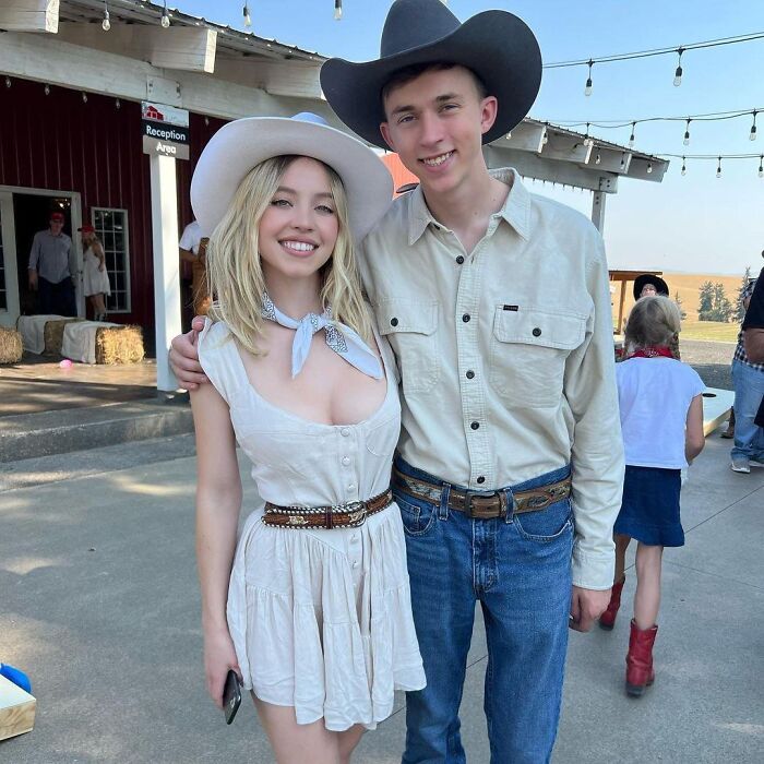 Sydney Sweeney and her brother wearing western attire, linked to rumored MAGA ties amid family protest controversy.
