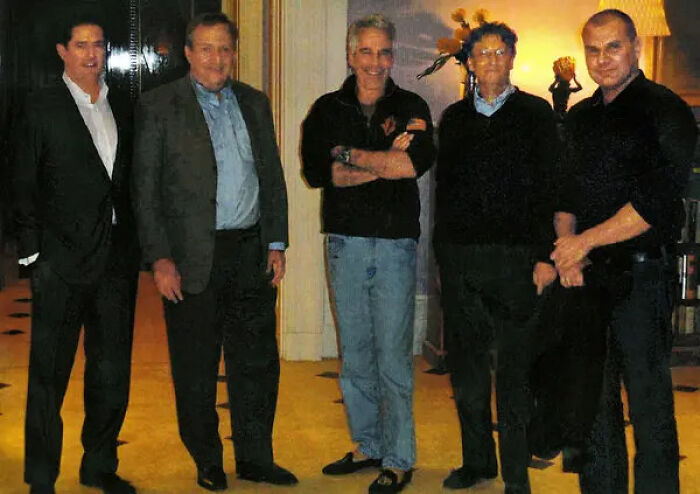 Group of men including Bill Gates and Jeffrey Epstein standing indoors in casual and formal wear, related to disturbing Bill Gates details.