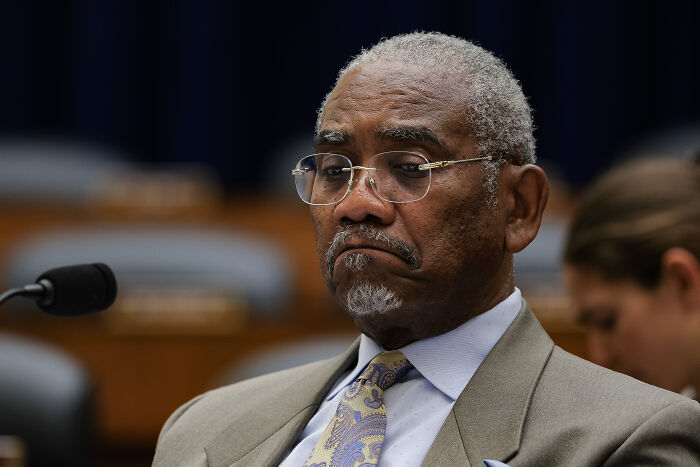 African American male congressman in a suit and glasses during House vote on cancelling tariffs with bipartisan support