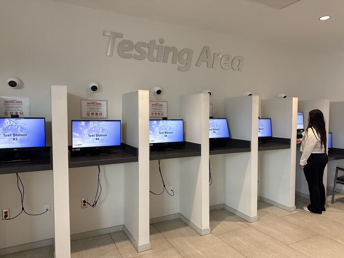 Testing area with computer stations and a person using a test station reflecting Florida&rsquo;s new law controversy.