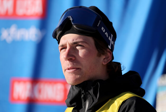 U.S. Olympian Hunter Hess wearing ski goggles and jacket during outdoor winter sports event.