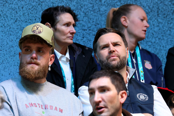 Trump and U.S. Olympic athlete in a tense moment during a public event, showing mixed emotions and confrontation.