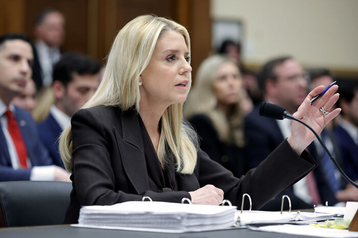 Bondi speaking passionately during House Democrats hearing, addressing conflict with representative and legal issues.