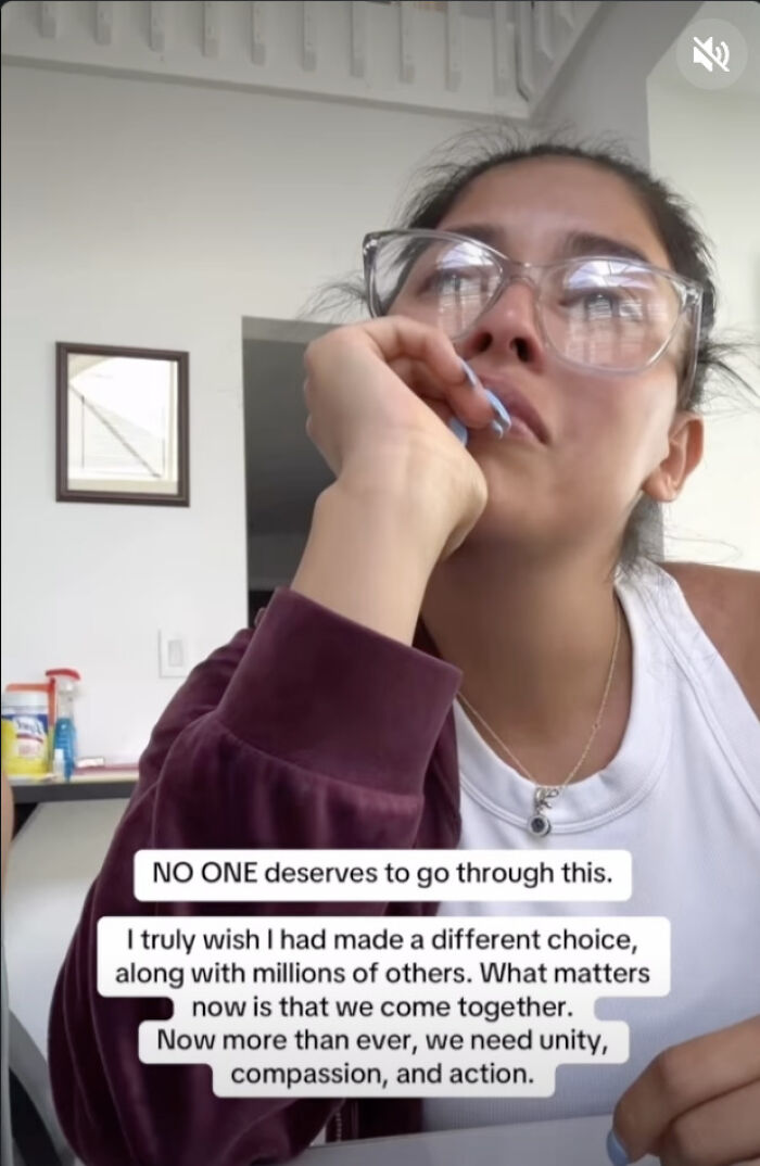 Woman with glasses looking distressed, reflecting on ICE detaining her terminally ill dad and seeking support.