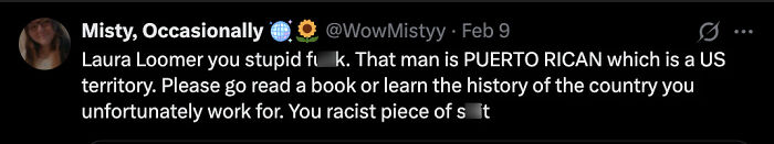 Screenshot of a controversial social media post targeting Laura Loomer with inflammatory language over racial issues.