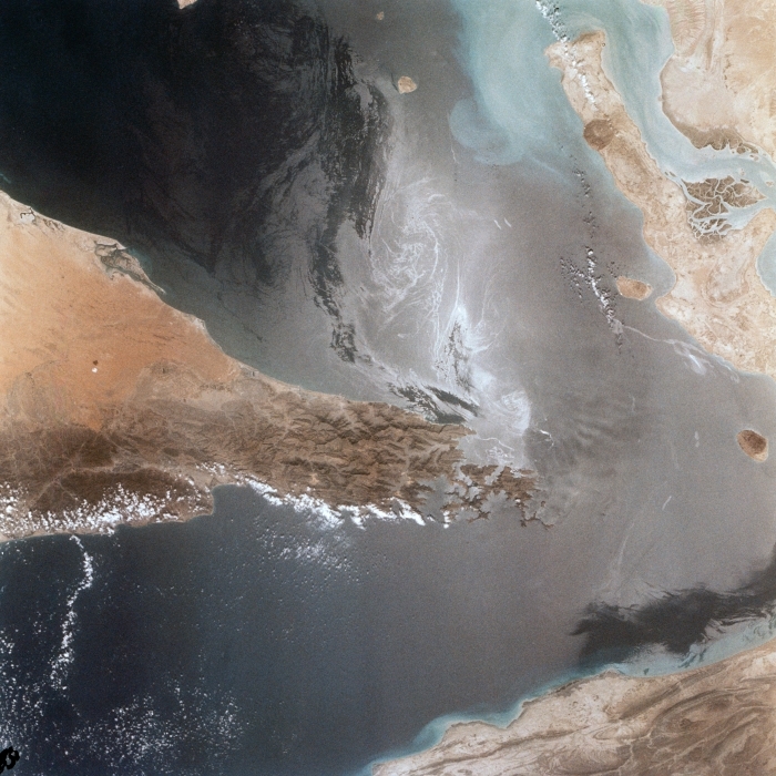 Satellite image of Strait of Hormuz showing oil slicks and ship wakes near Iran deal area Satellite image of Strait of Hormuz showing oil slicks and ship wakes near Iran deal area