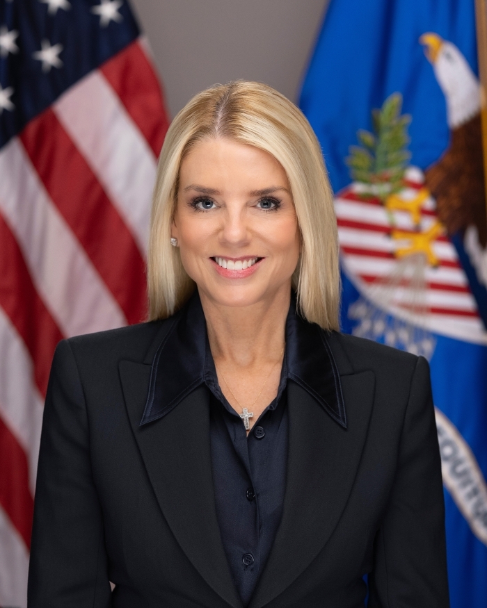 Official portrait of Pam Bondi with American flag, representing cancer diagnosis return