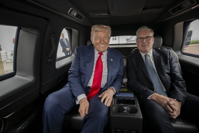 Donald Trump sitting inside a vehicle with another man, related to Indian Ocean islands report