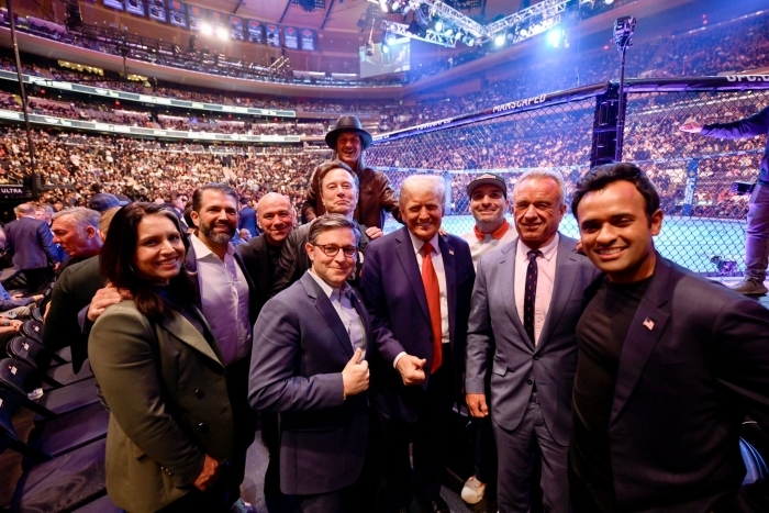 Donald Trump and UFC figures at arena posing for photo before UFC event
