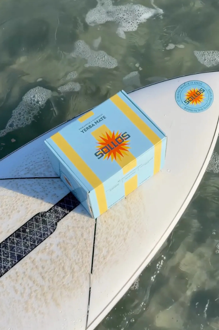 Box of Barron Trump's $39 Yerba Mate on a surfboard over water Box of Barron Trump's $39 Yerba Mate on a surfboard over water